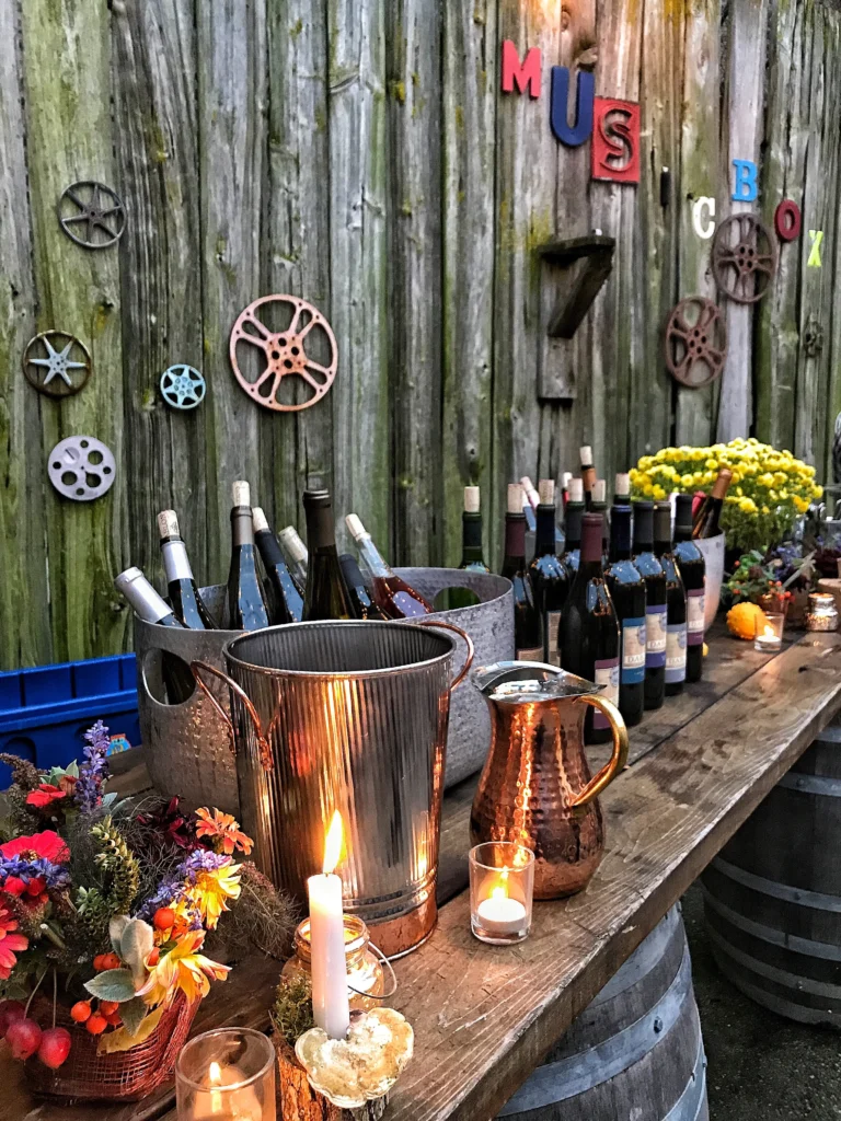 Bottles of wine set up on a wooden bar