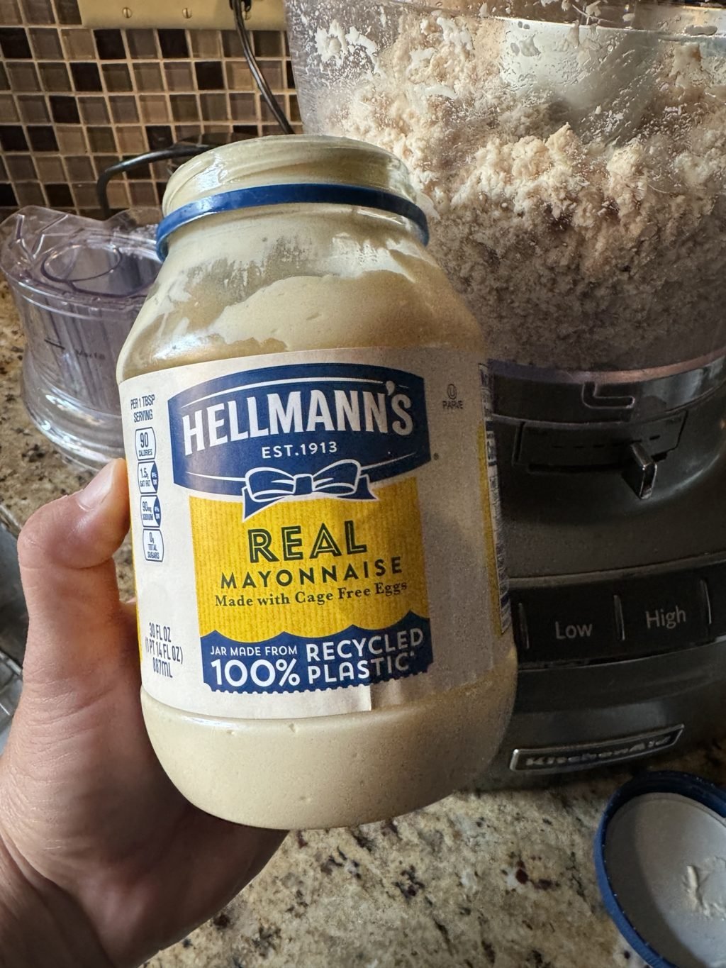 An open jar of Hellmann's mayo