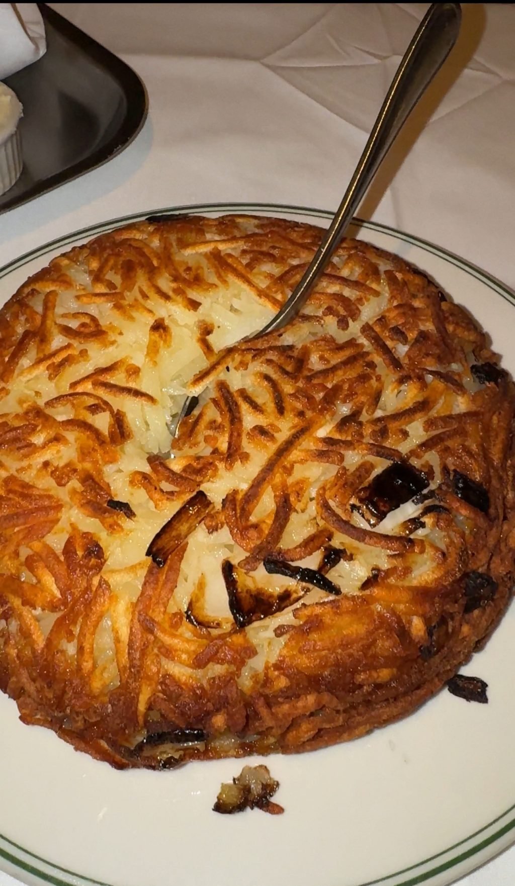 Hash browns with a spoon.