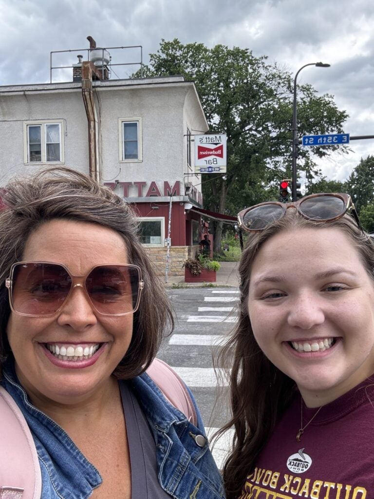 A selfie of my cousin an me standing out side Matt's in Minneapolis.