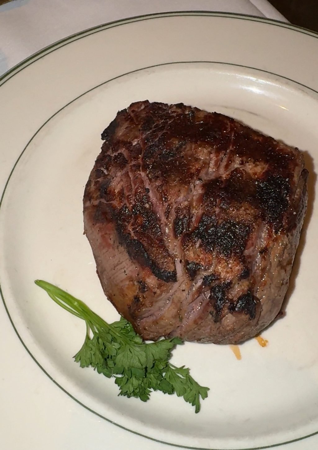 A spinalis steak on a plate.