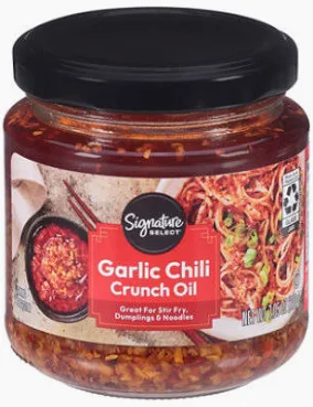 A jar of garlic chili crunch oil.