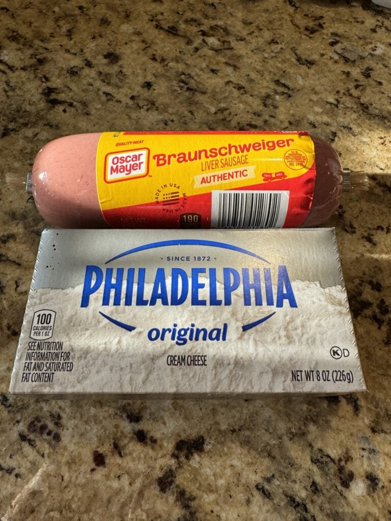 A package of Oscar Mayer Braunschweiger Liver Sausage next to a box of Philadelphia Cream Cheese.