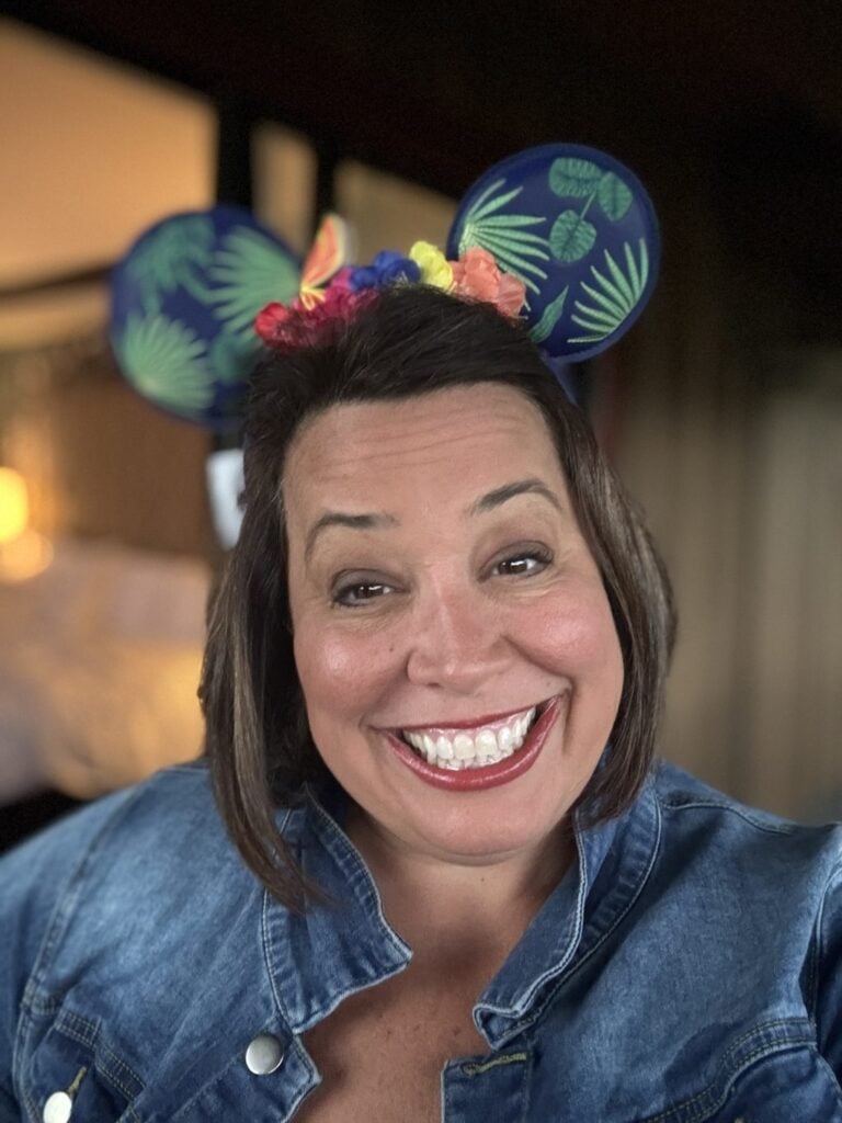 A selfie of me wearing leaf pattern Micky ears.