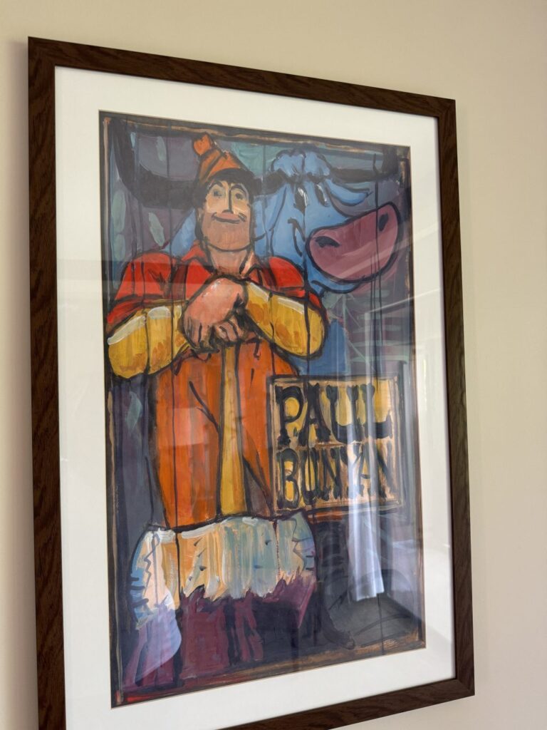 A painting of Paul Bunyan and Babe the Blue Ox.
