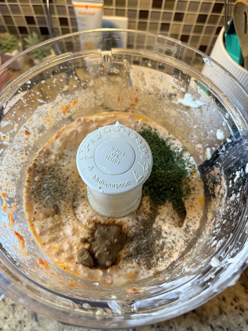 The ingredients for the dip in a food processor. 