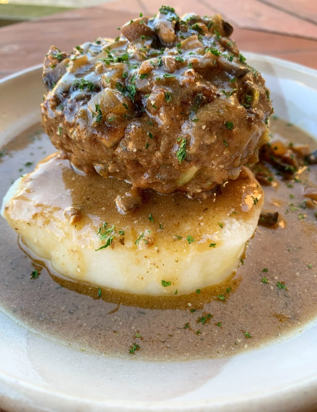 Polish Hamburger over potatoes
