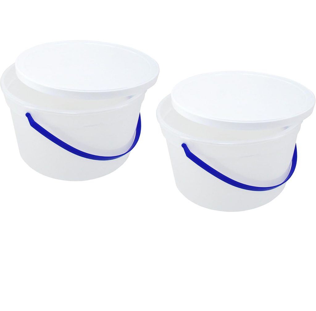 Two empty white plastic ice cream vats.