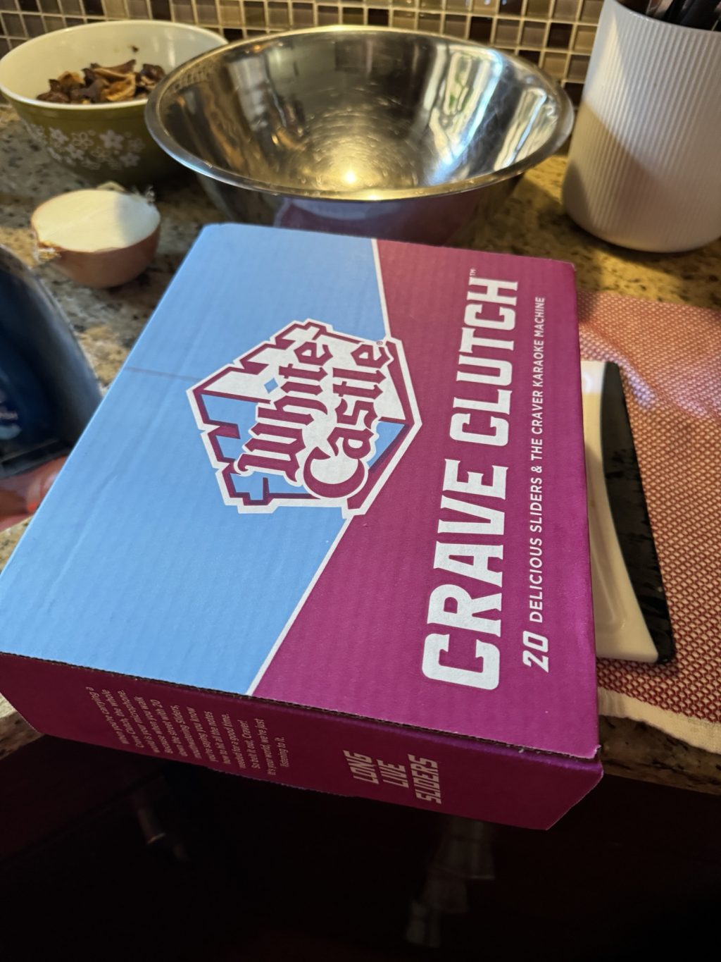 A cardboard "Crave Clutch" box of White Castle sliders.