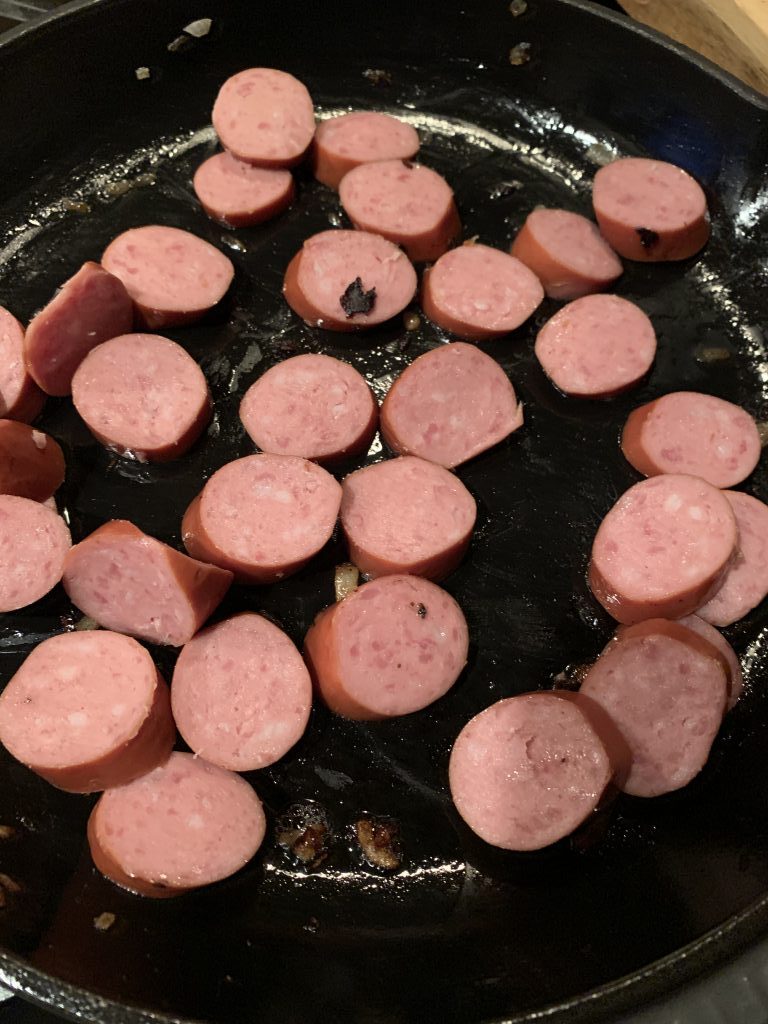 Sliced sausage in a pan