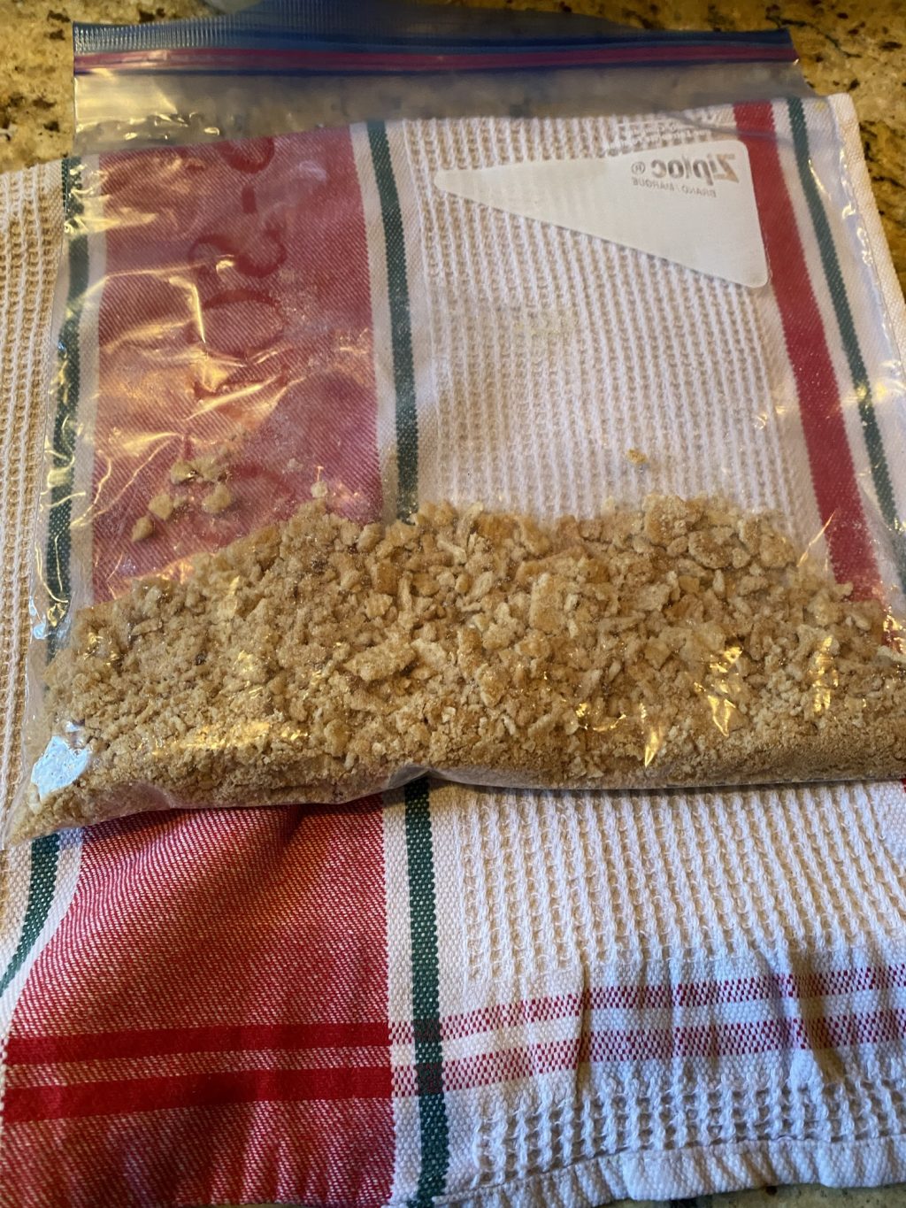 A Ziploc bag filled with crushed Cinnamon Toast Crunch.