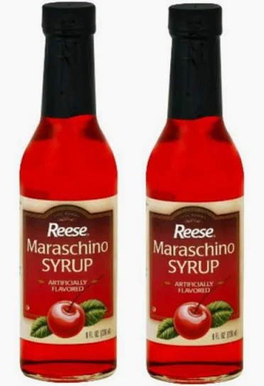 Two bottles of maraschino cherry syrup