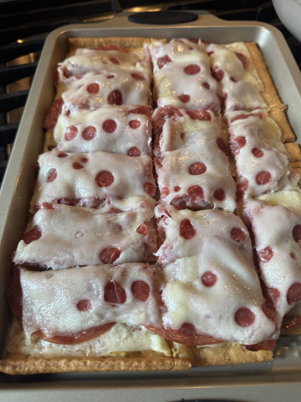 Melted cheese on top of the cold cut flatbread