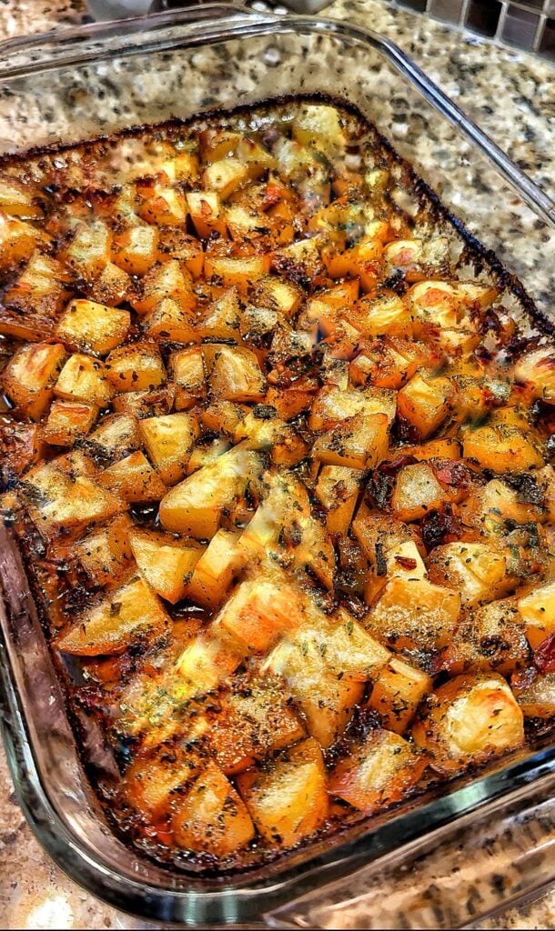 A glass dish with baked breakfast potatoes