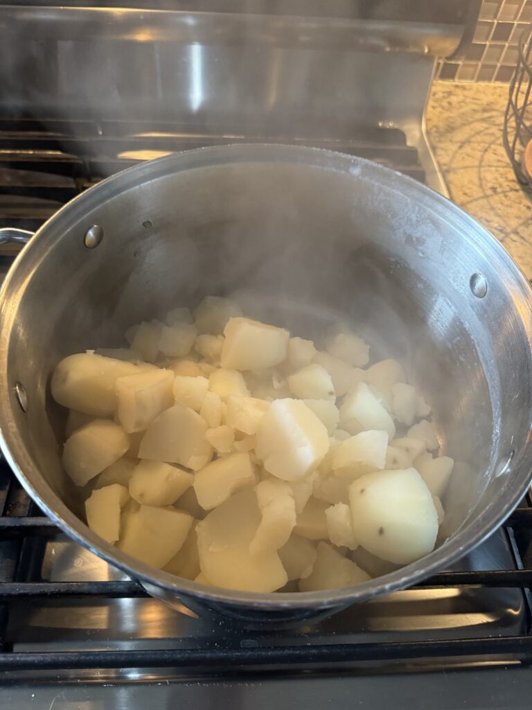 Boiled potatoes in a pot