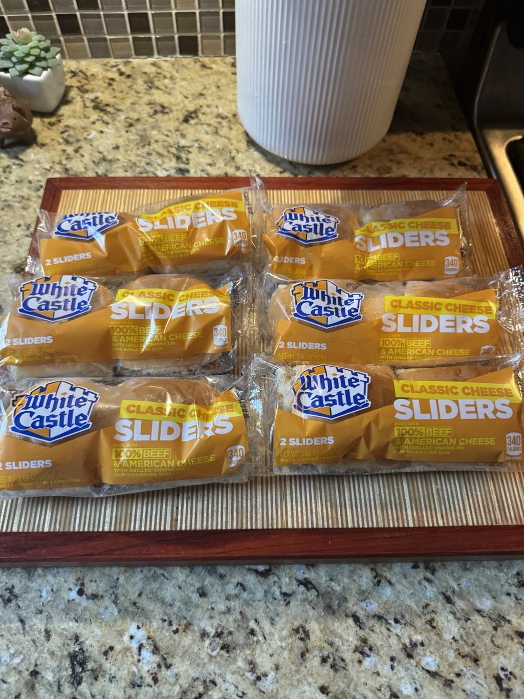 Six packages of frozen White Castle sliders, each with two sliders