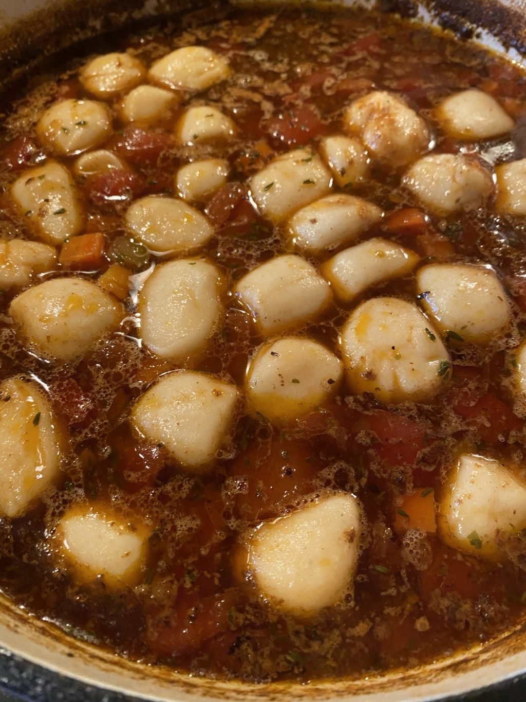Dumplings in beef soup