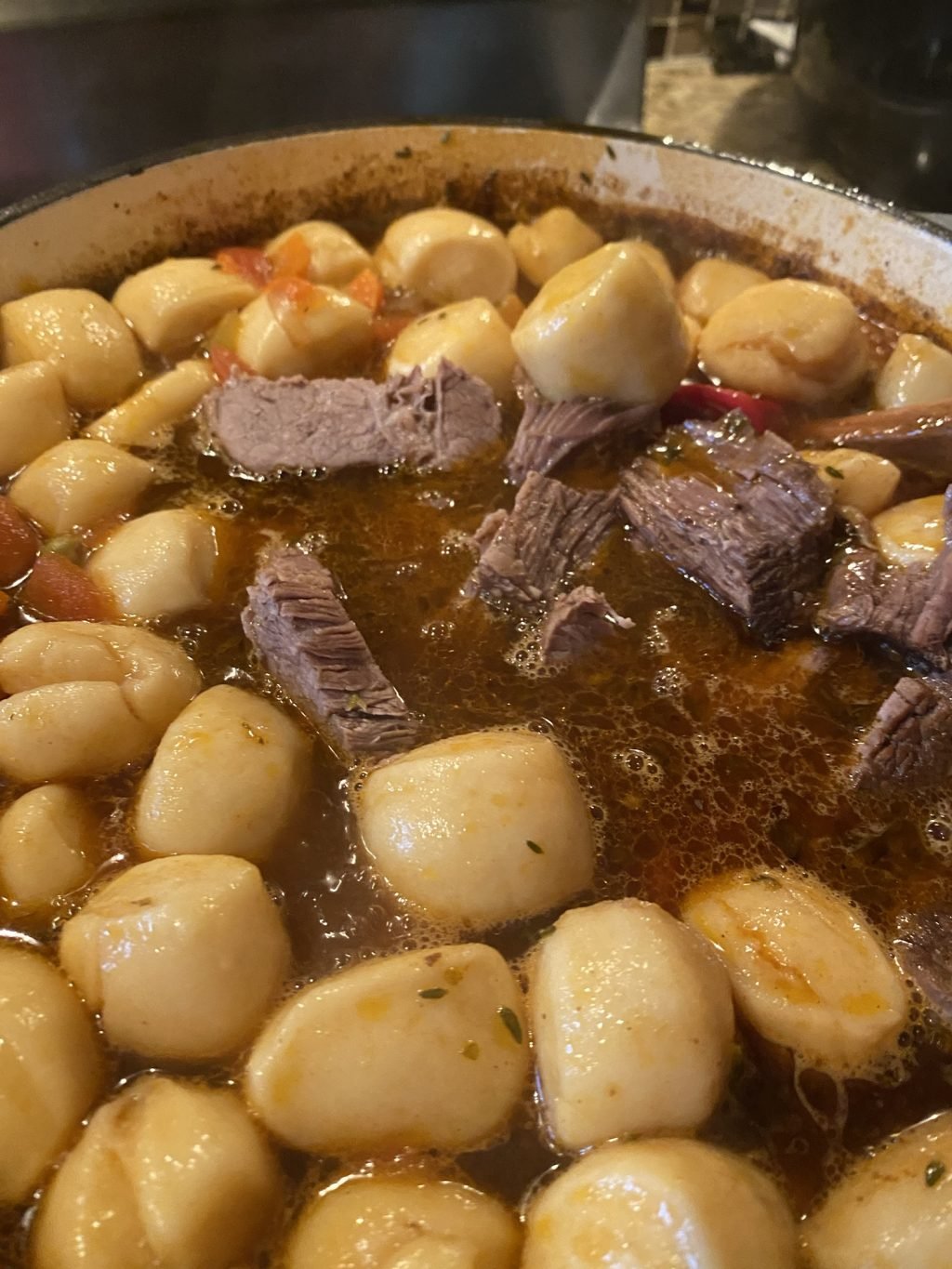 A close up of the beefy dumpling soup
