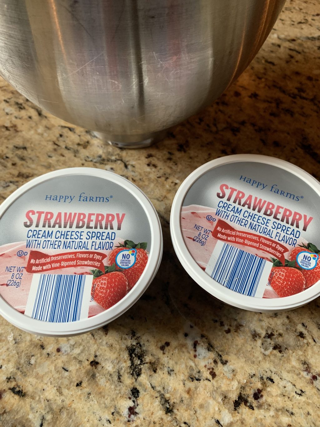 Two containers of strawberry cream cheese