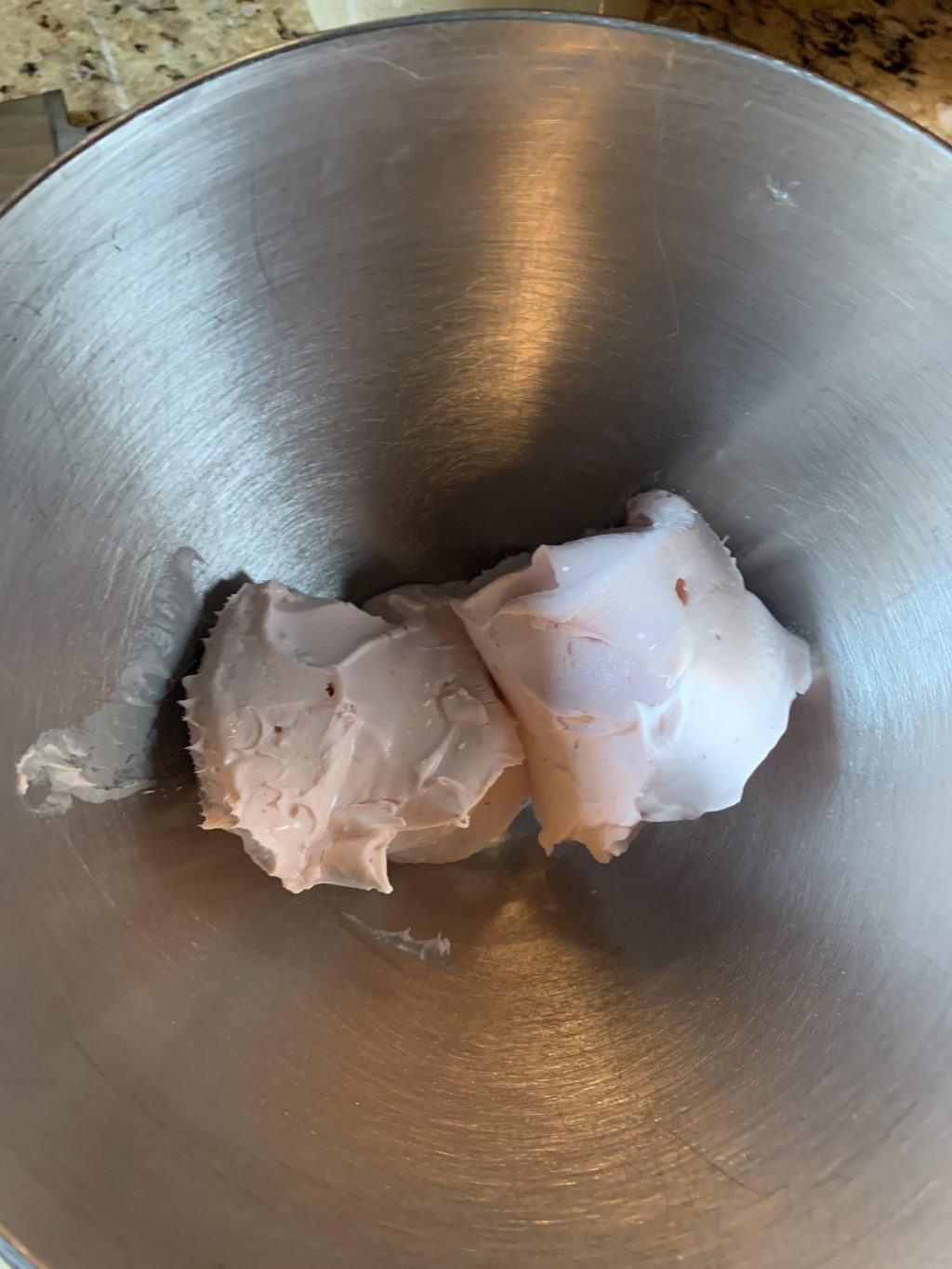Strawberry cream cheese in a metal bowl