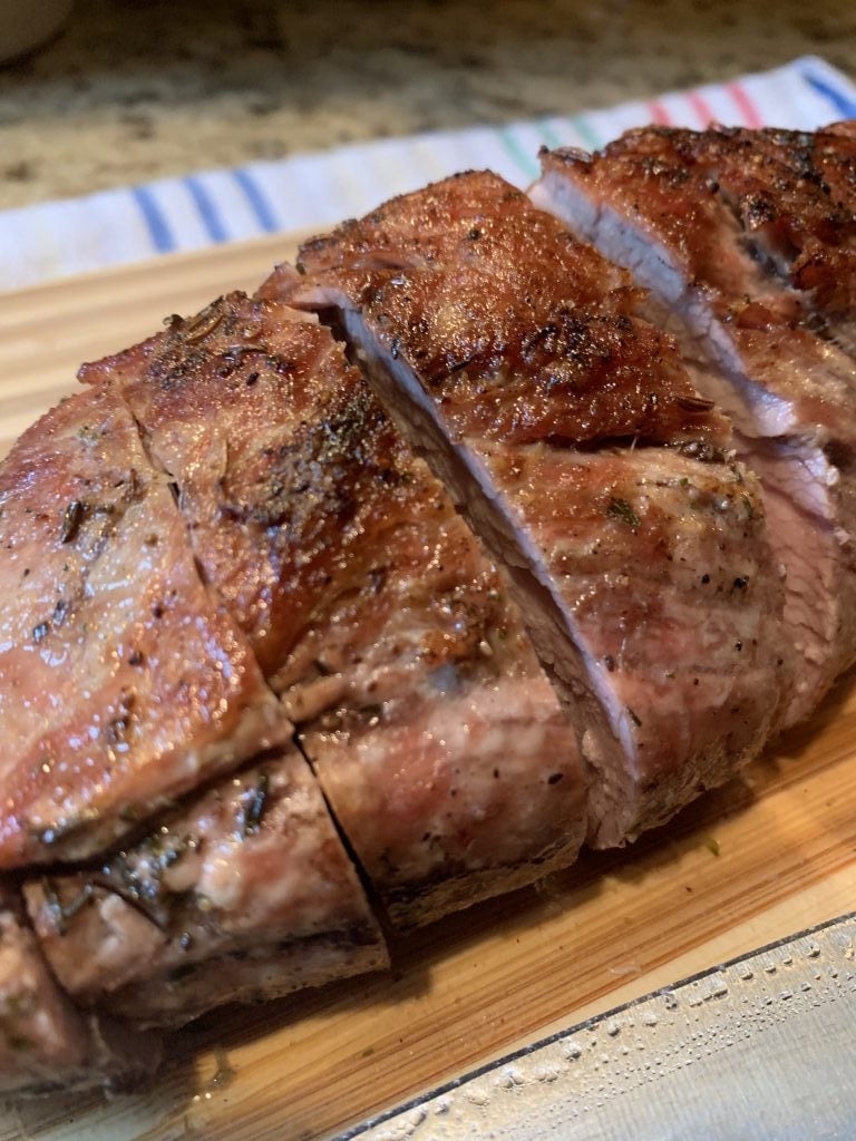 Sliced pork on a cutting board