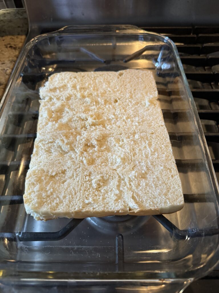 A half slab of rolls, cut vertically, in a glass baking dish