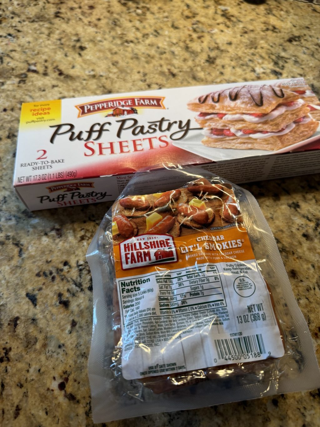 A box of Puff Pastry sheets and a package of Hillshire Farm little cheddar sausages