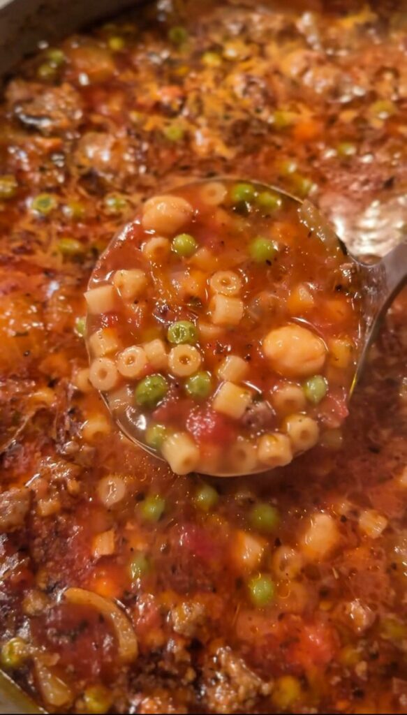 A ladle of Skillet Sausage Soup