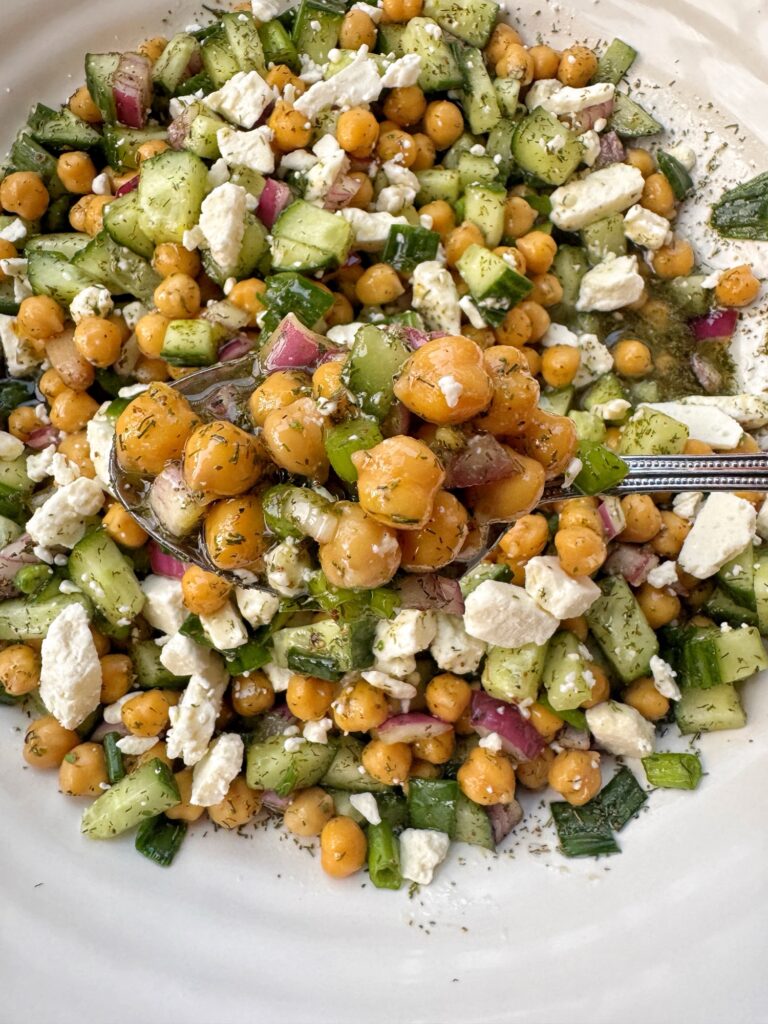 A spoon of Chilled Greek Bean Salad