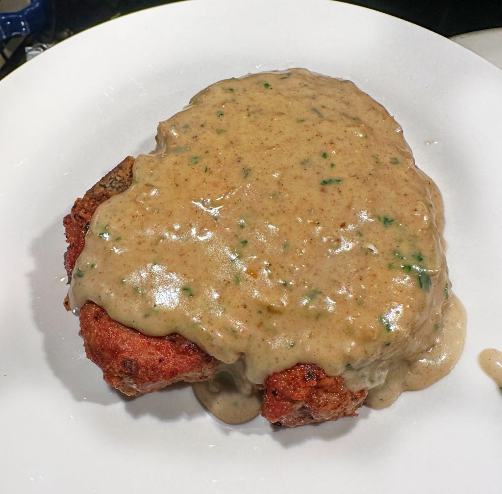 Fried pork chop with blue cheese sauce