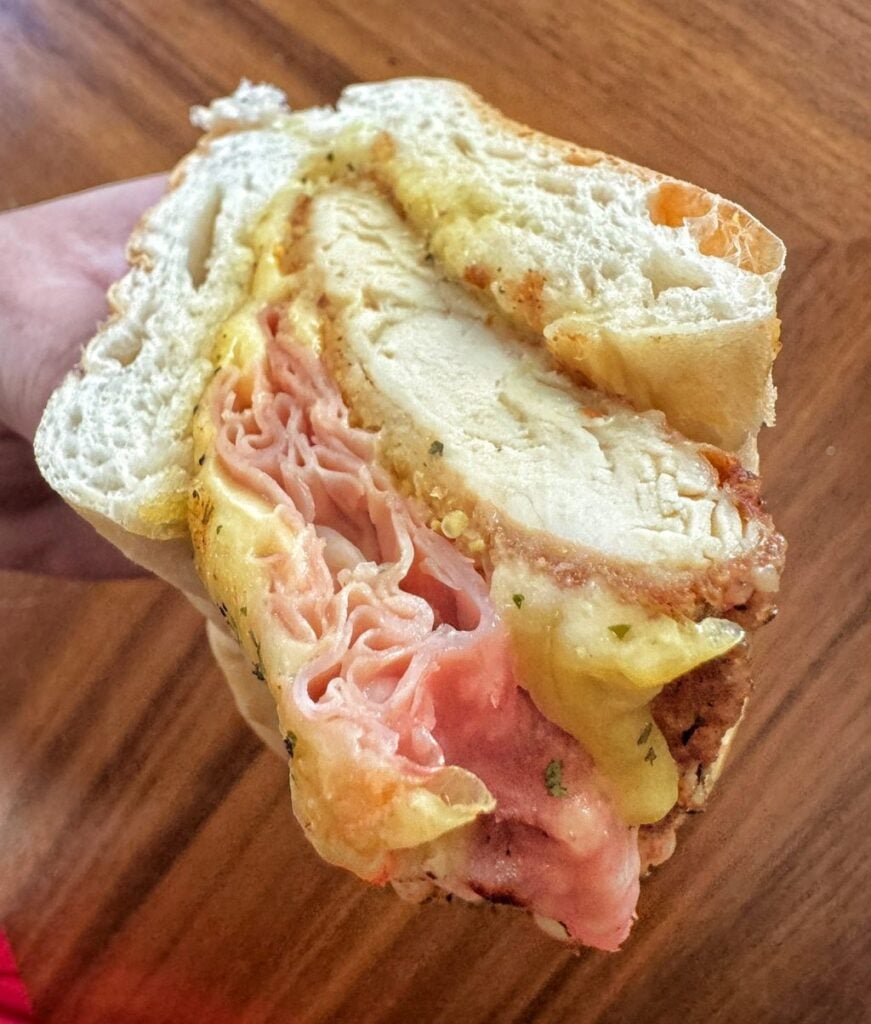 Half of a chicken, ham, and Swiss sub