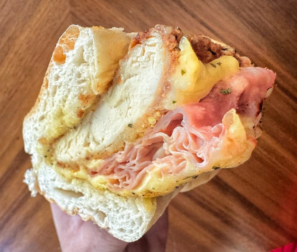 A chicken, ham, and Swiss sub sandwich