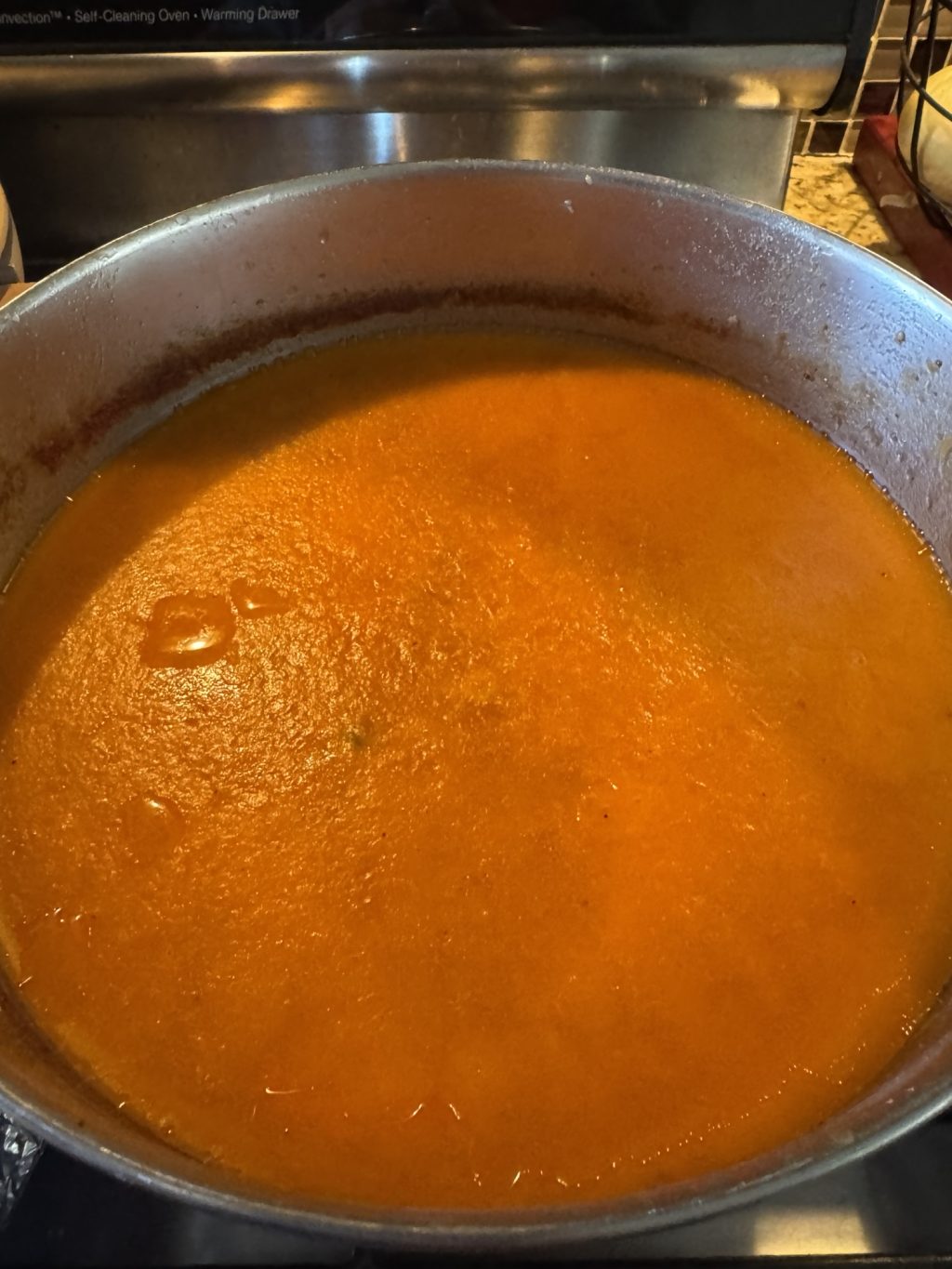 Soup after being taken out of the fridge, with a layer of fat on the top