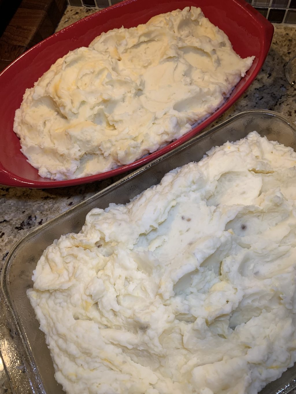 Two dishes of mashed potato casserole