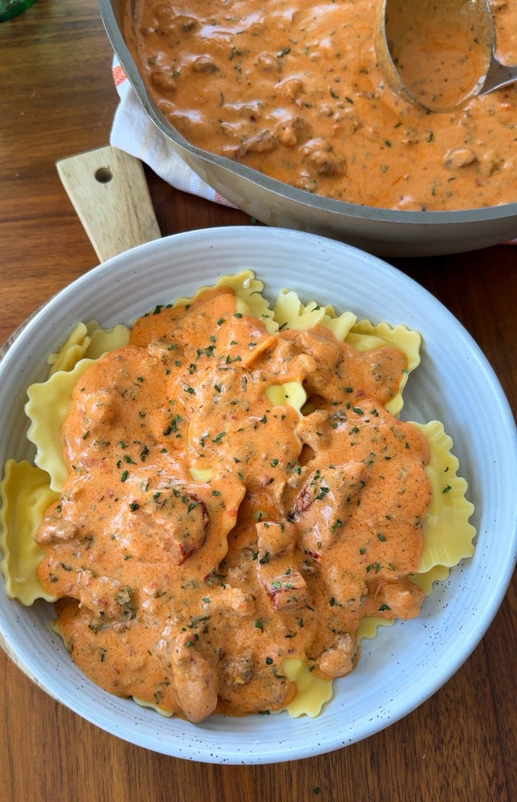 A bowl of ravioli with pink ravioli sauce