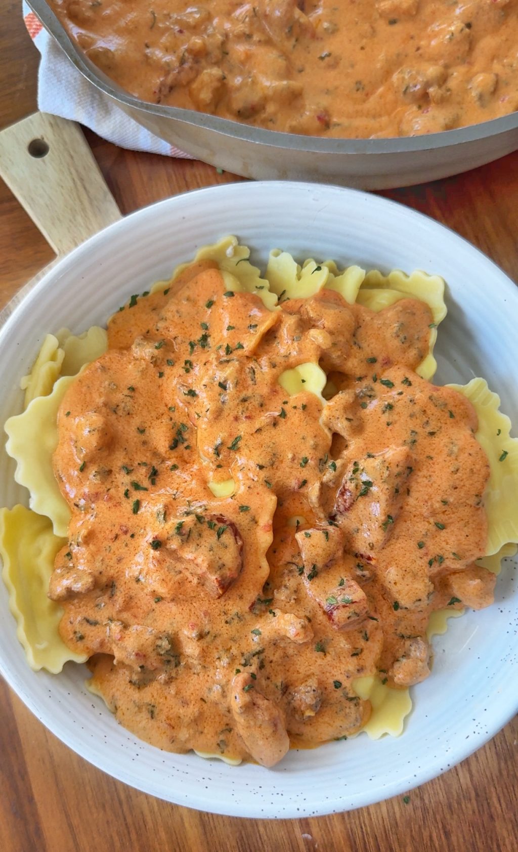 Ravioli in a bowl with ravioli sauce on top