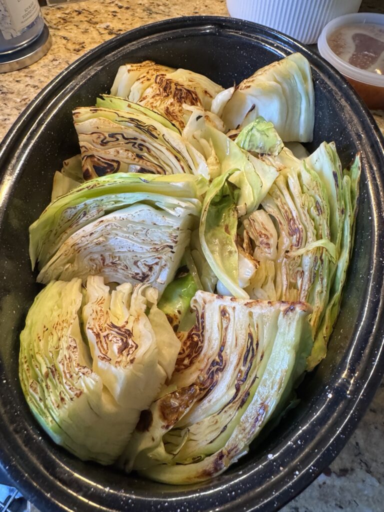 Seared cabbage wedges in the roasting pan