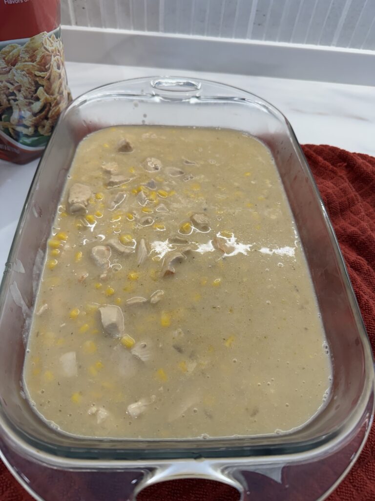 The casserole mixture in a glass baking dish