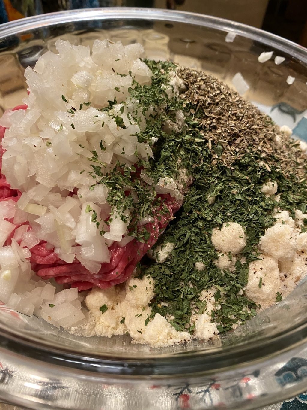 The ingredients for the meatballs in a bowl