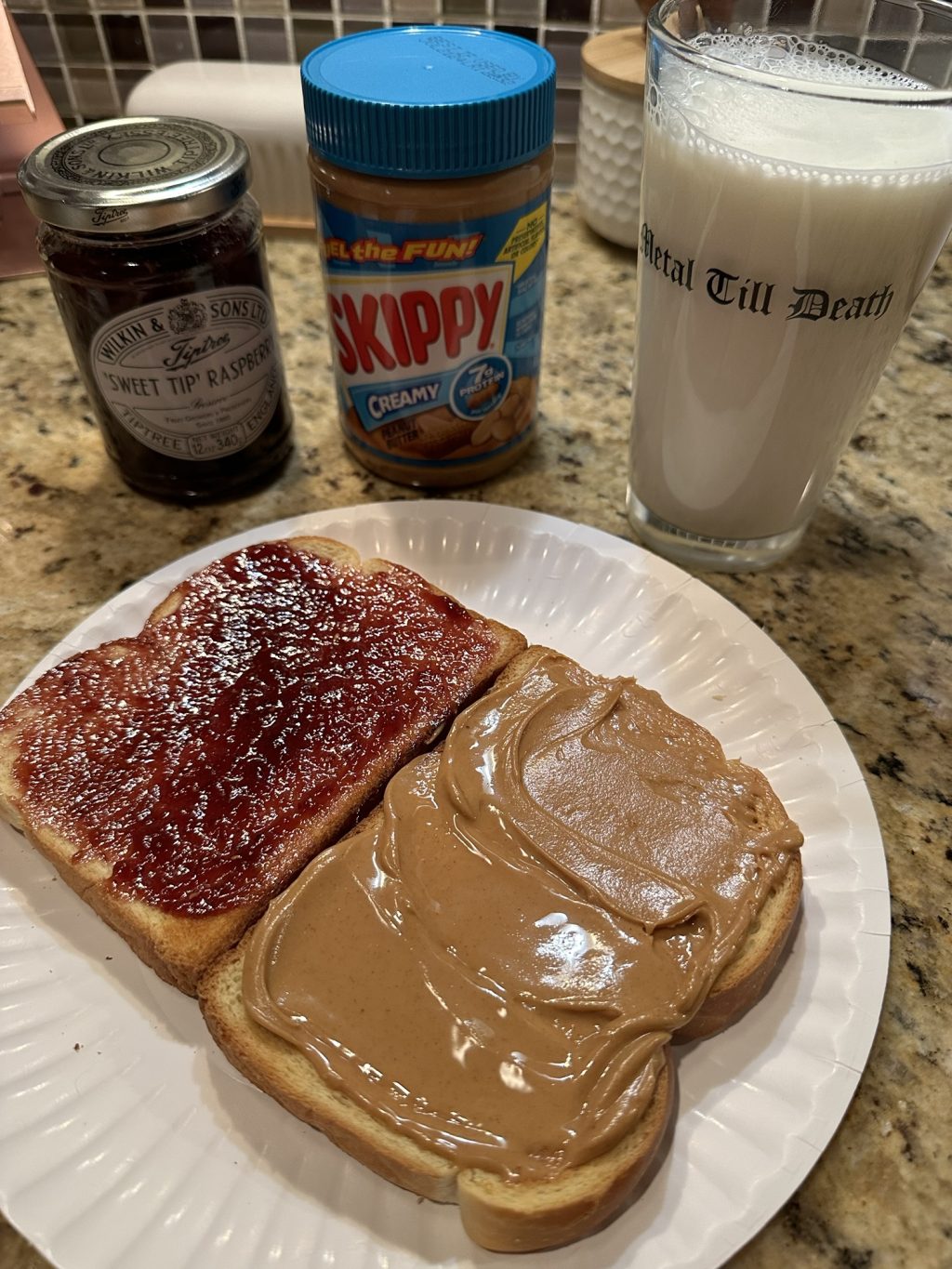 Peanut butter and jelly sandwich with milk