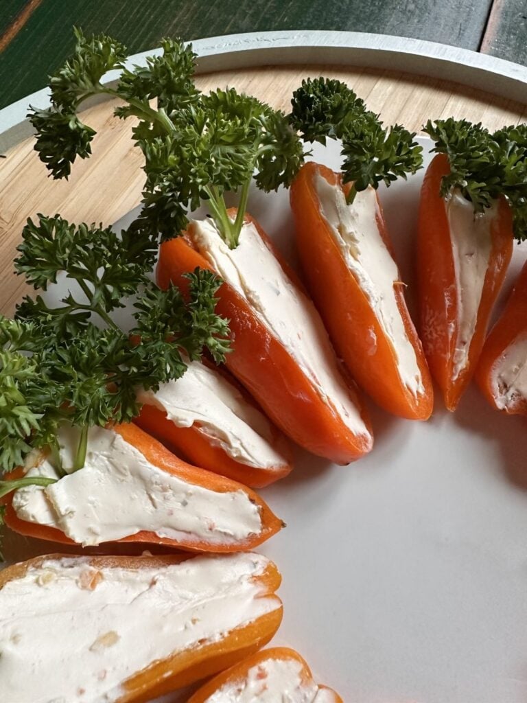 Orange peppers with cream cheese stuffing that look like carrots