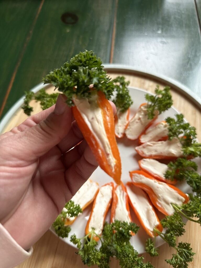 Orange peppers with cream cheese stuffing that look like carrots