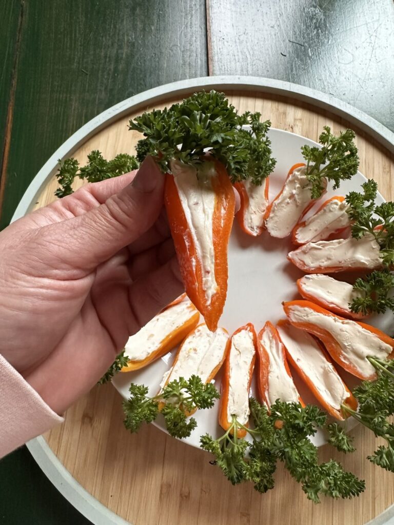 A stuffed pepper held above the others