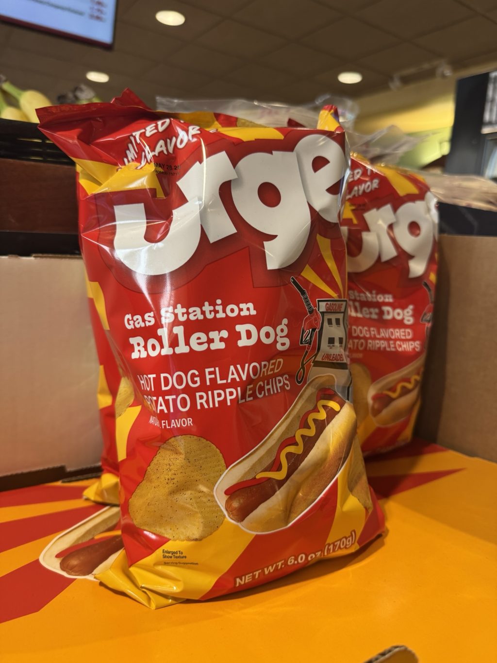Two bags of hot dog flavored potato chips.