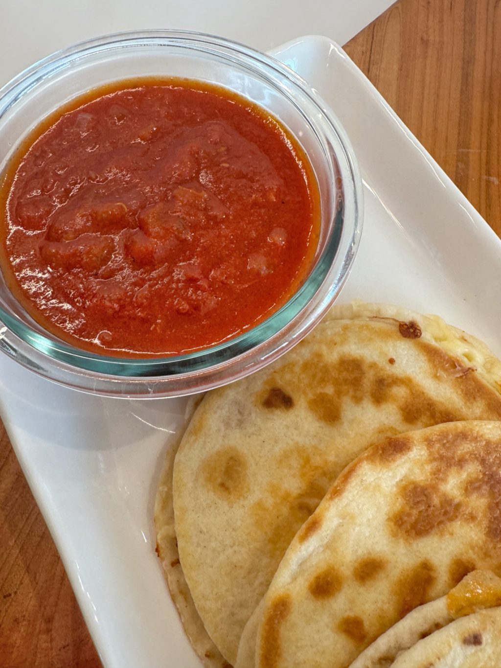 A close up of the quesadillas and warm salsa