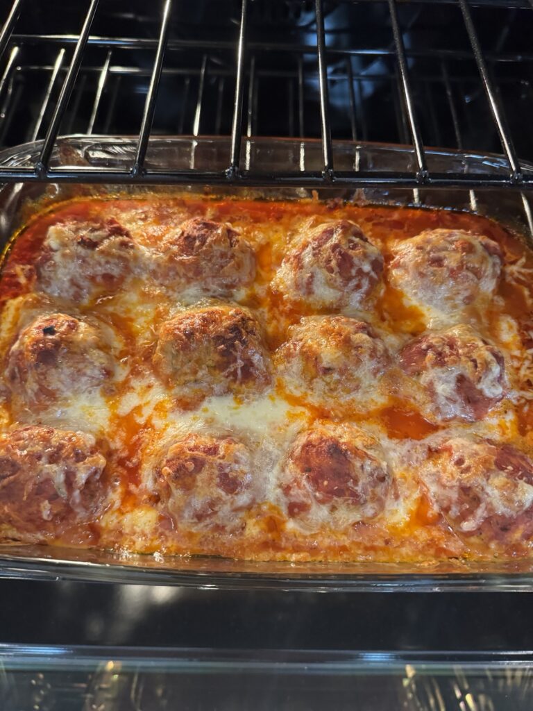 The meatballs coming out of the oven
