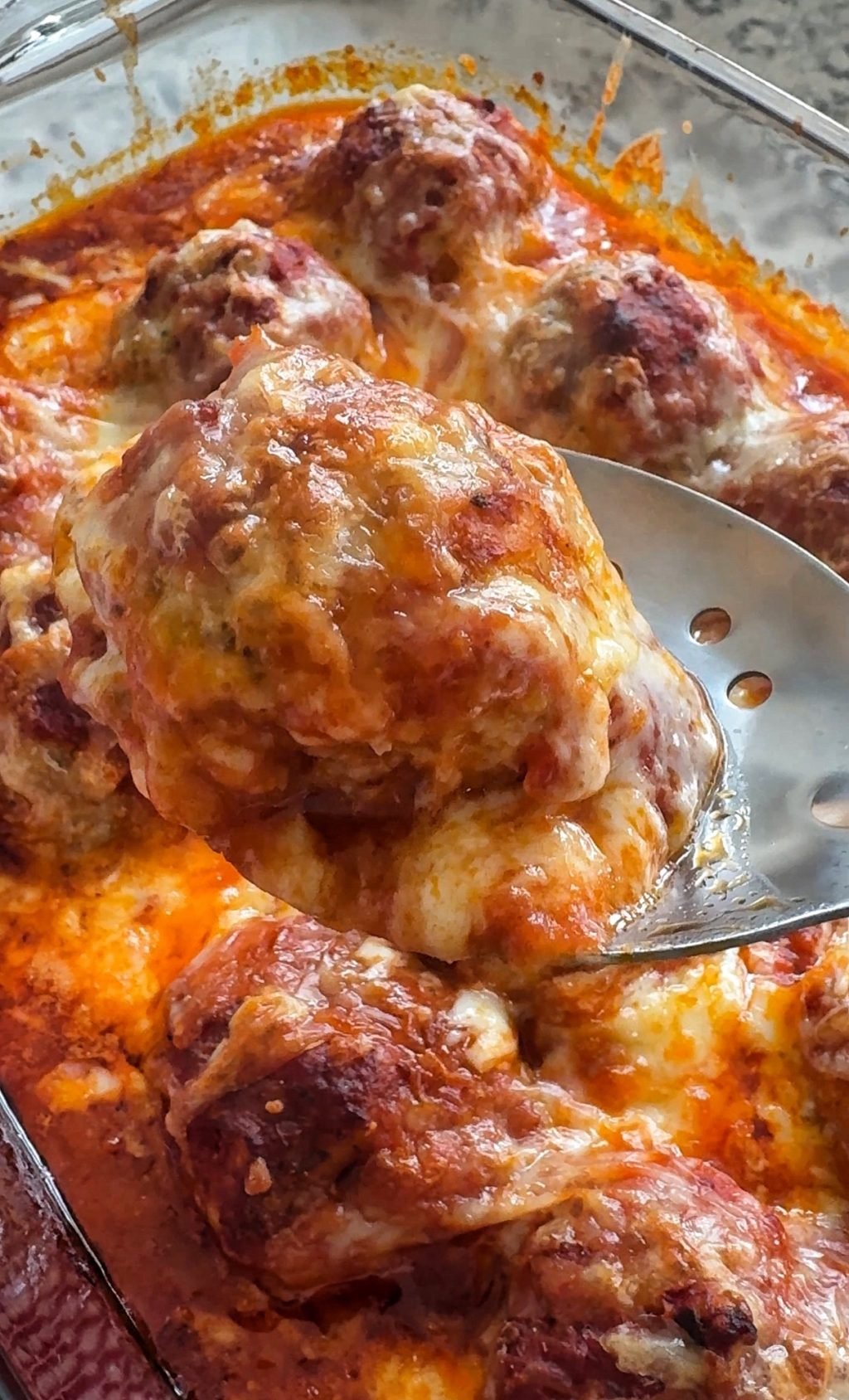 A finished meatball on a spoon
