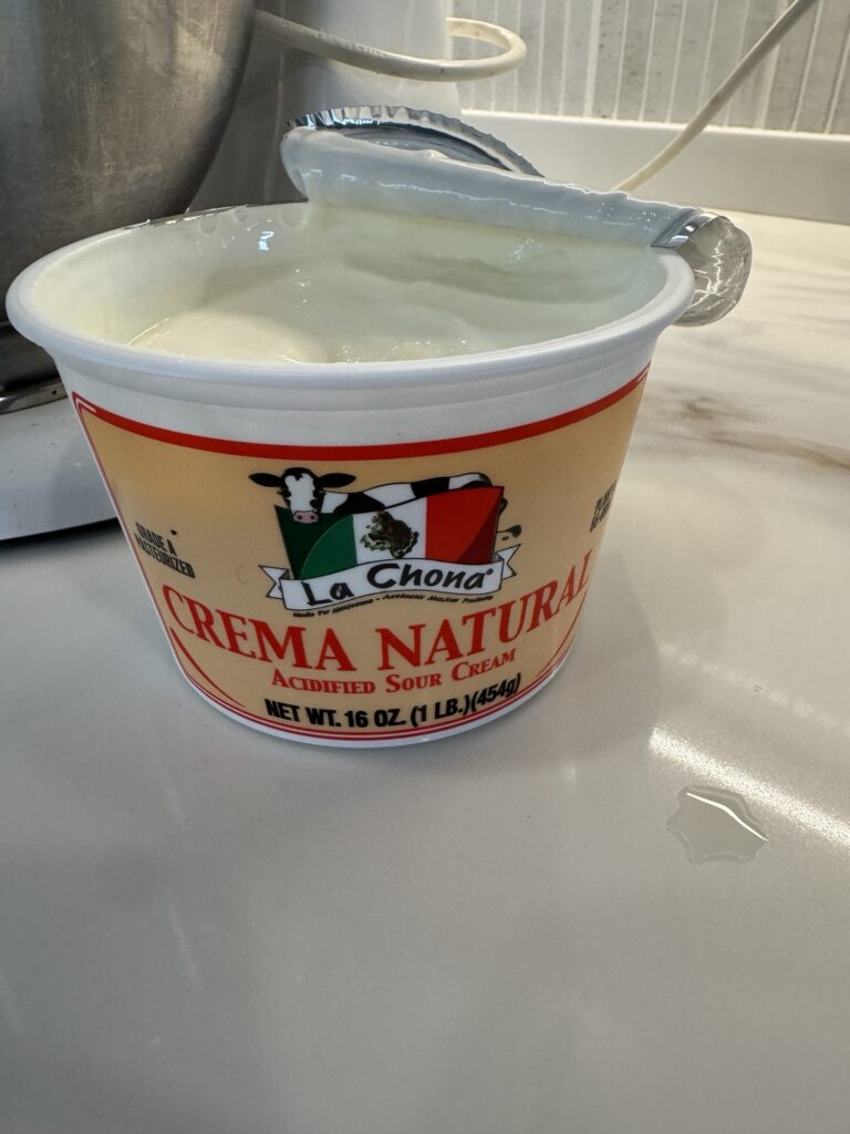 A container of Mexican sour cream