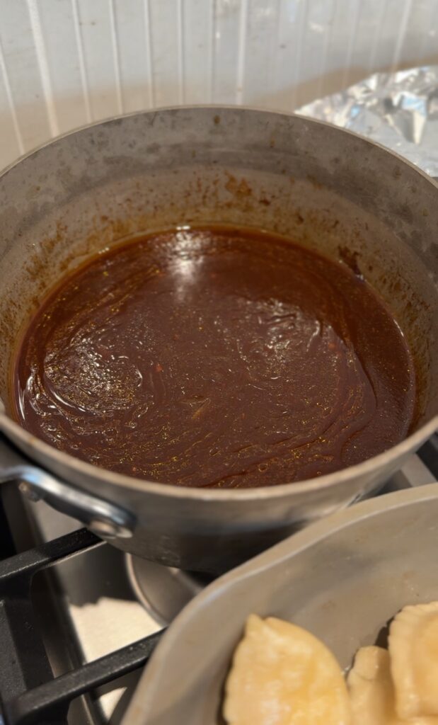 The brisket sauce in a pot