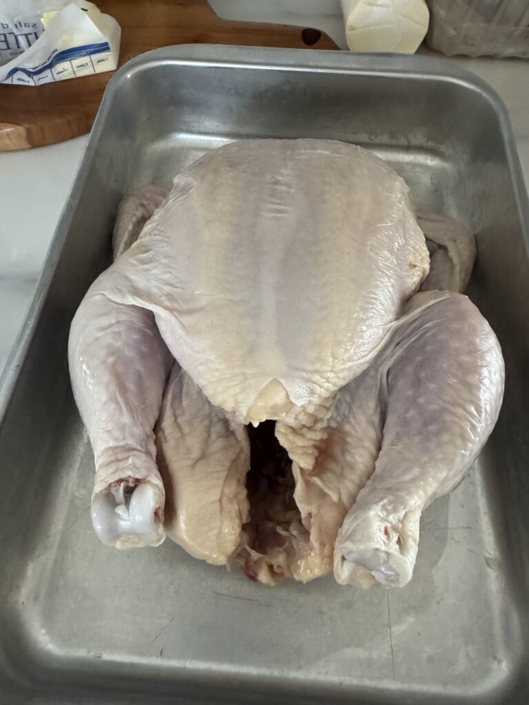 A whole, raw chicken